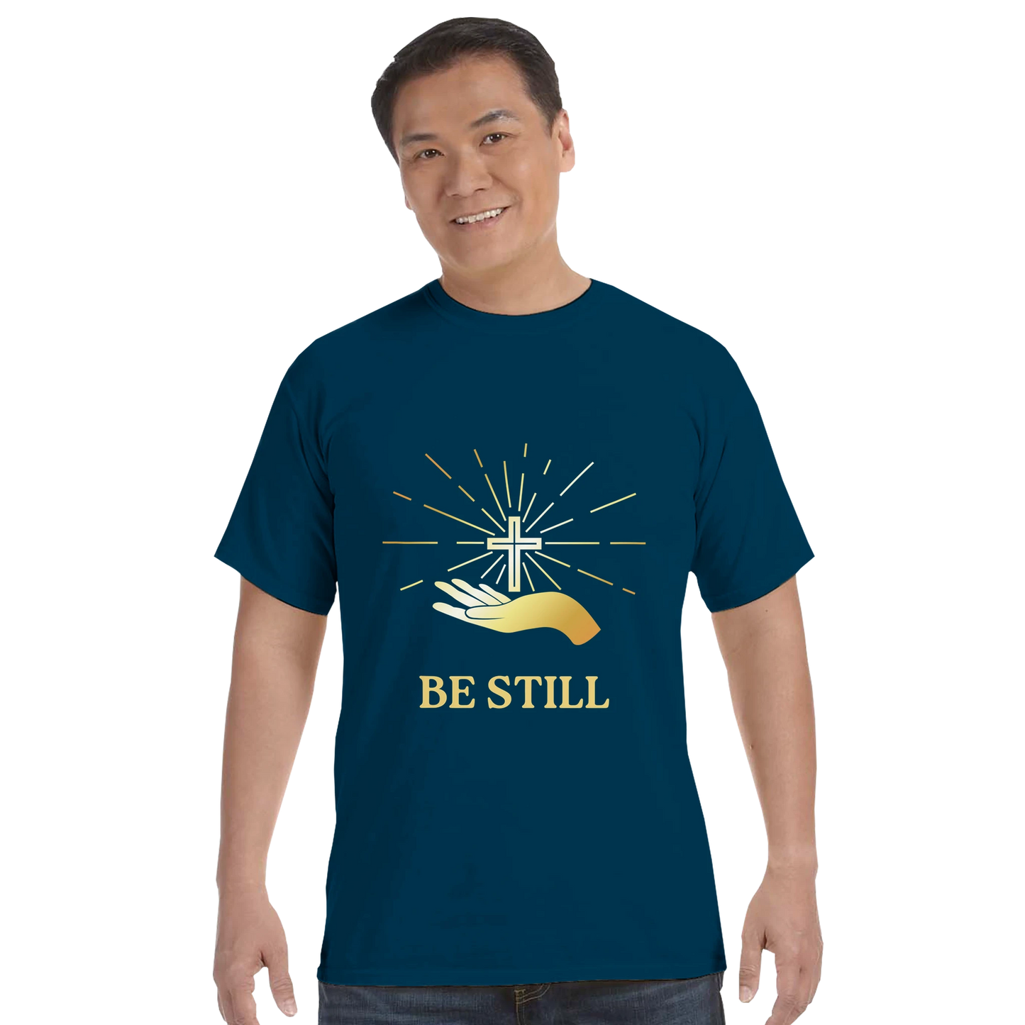 Navy Christian graphic t-shirt featuring a hand and cross design with the text Be Still