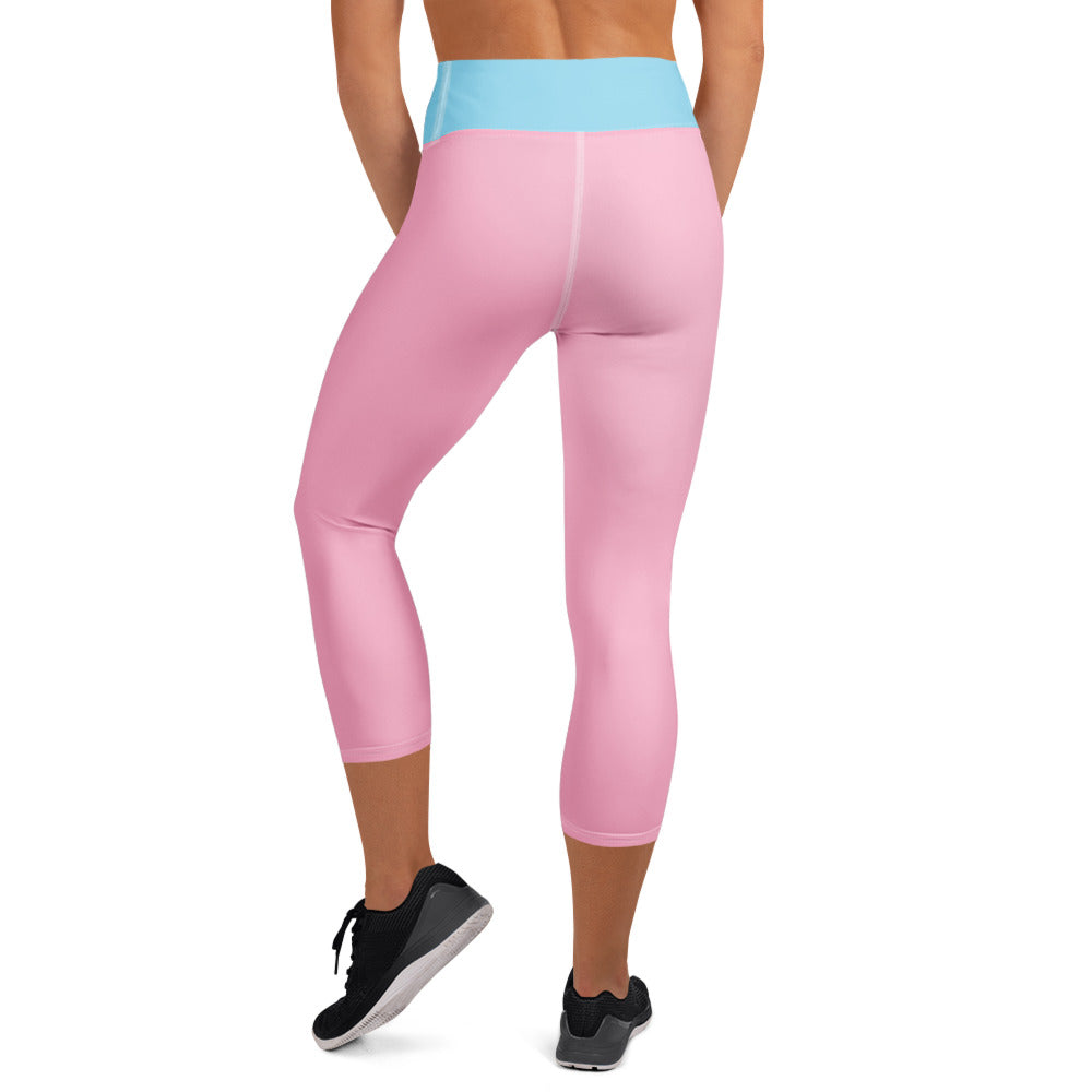 Back view of pink and blue Christian yoga leggings worn with black sneakers by Spirit Wear