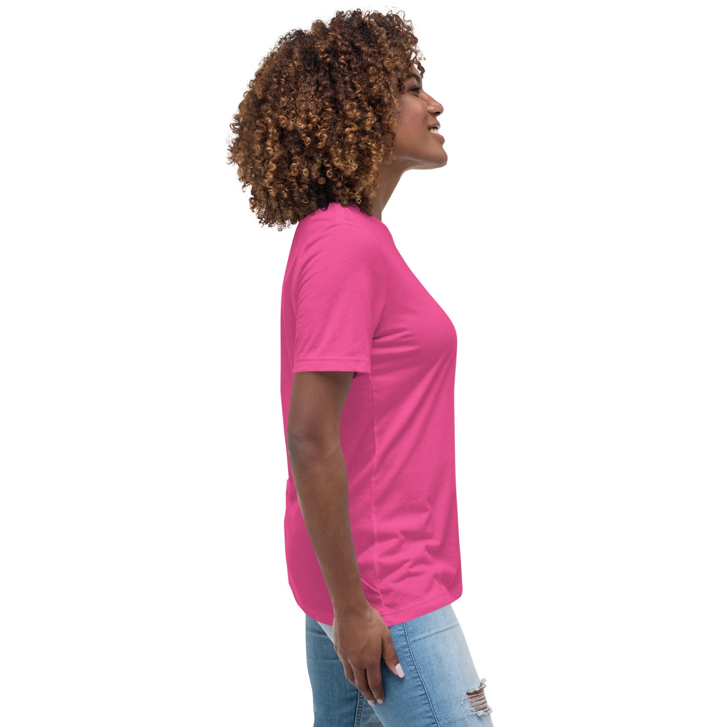 Woman wearing a bright pink inspirational graphic tee for women from Spirit Wear, paired with ripped jeans