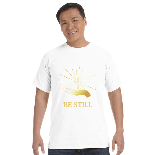 Christian graphic t-shirt featuring the phrase Be Still and a shining hand design