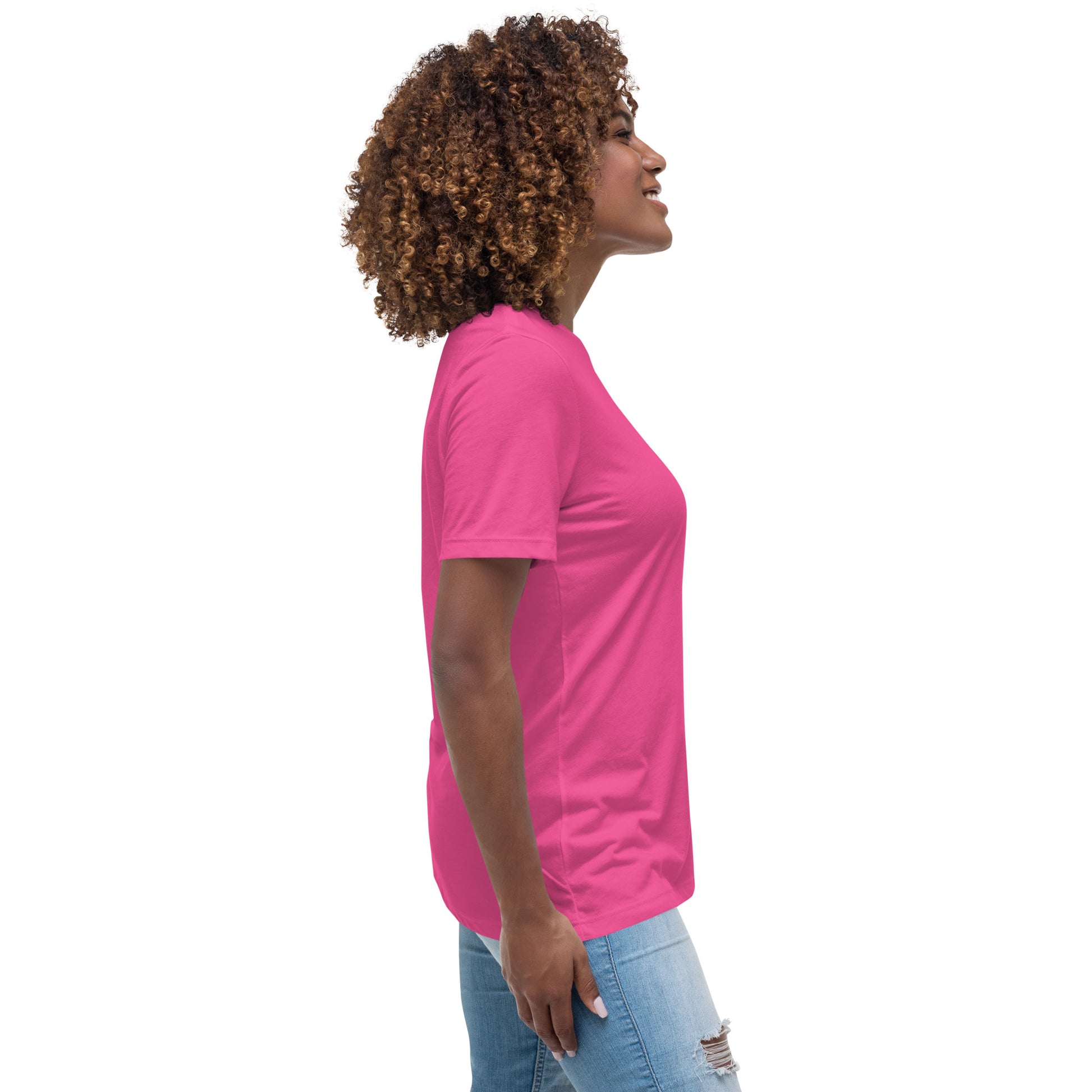 Woman wearing a bright pink inspirational graphic tee for women from Spirit Wear, paired with ripped jeans