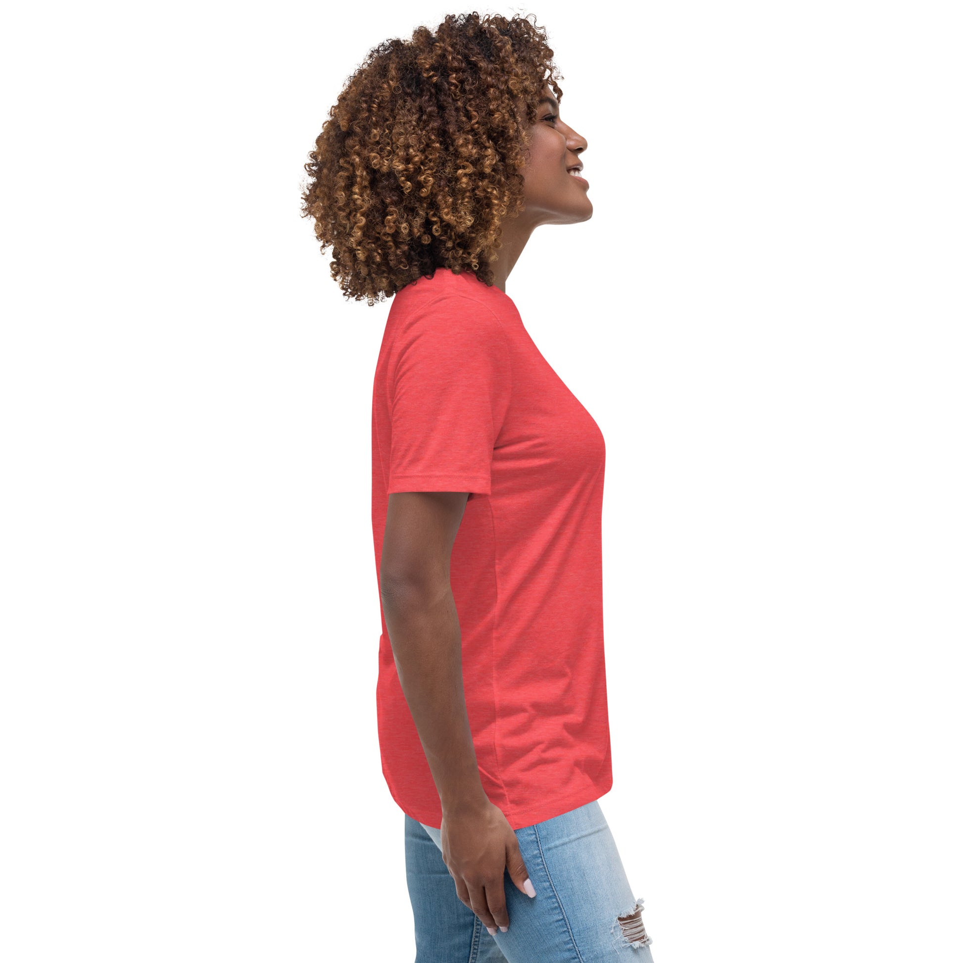 Woman wearing a red inspirational graphic tee for women paired with blue ripped jeans on white background