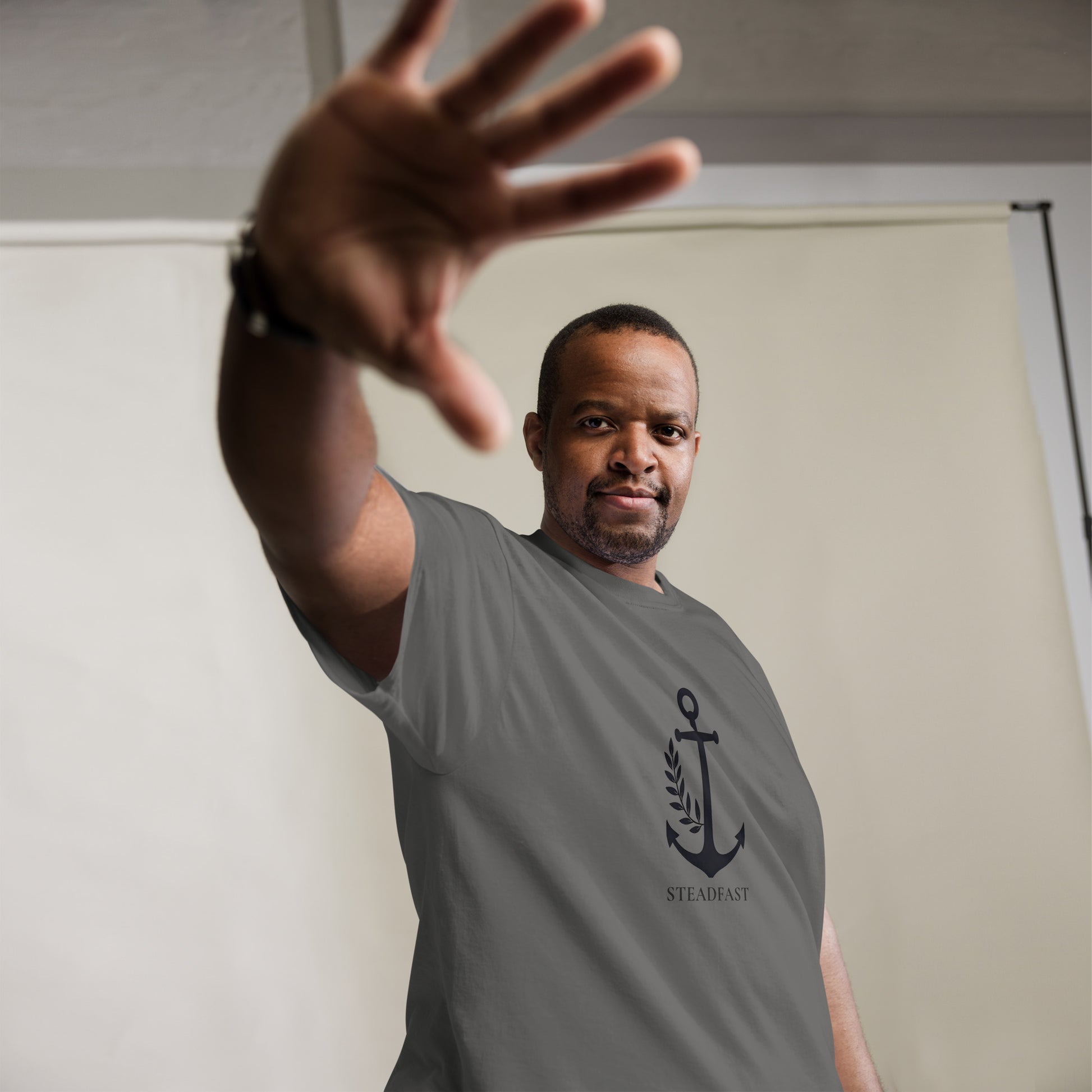 Spirit Wear Christian t-shirt withchor design anchor emblem on gray tee worn by smiling man