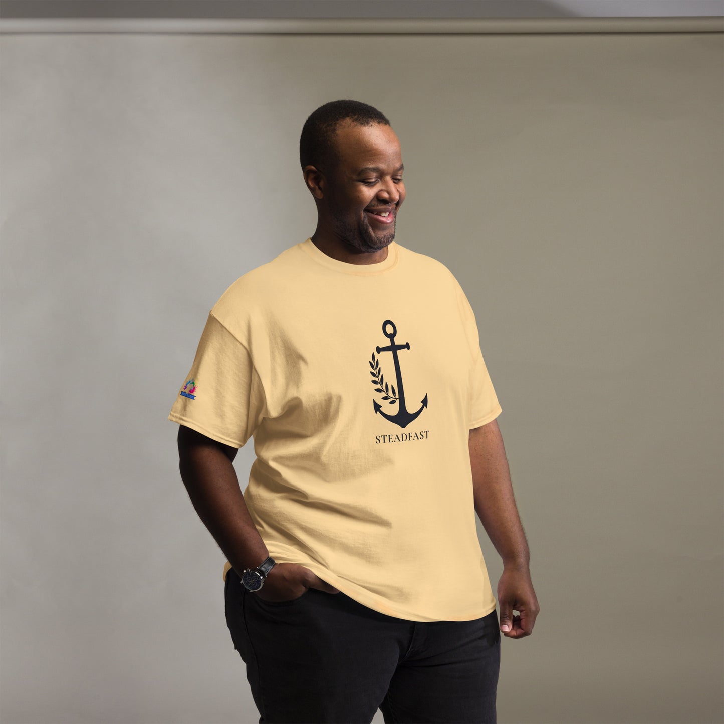 Smiling man wearing Spirit Wear Christian t-shirt withchor design featuring anchor motif and STEADFAST text