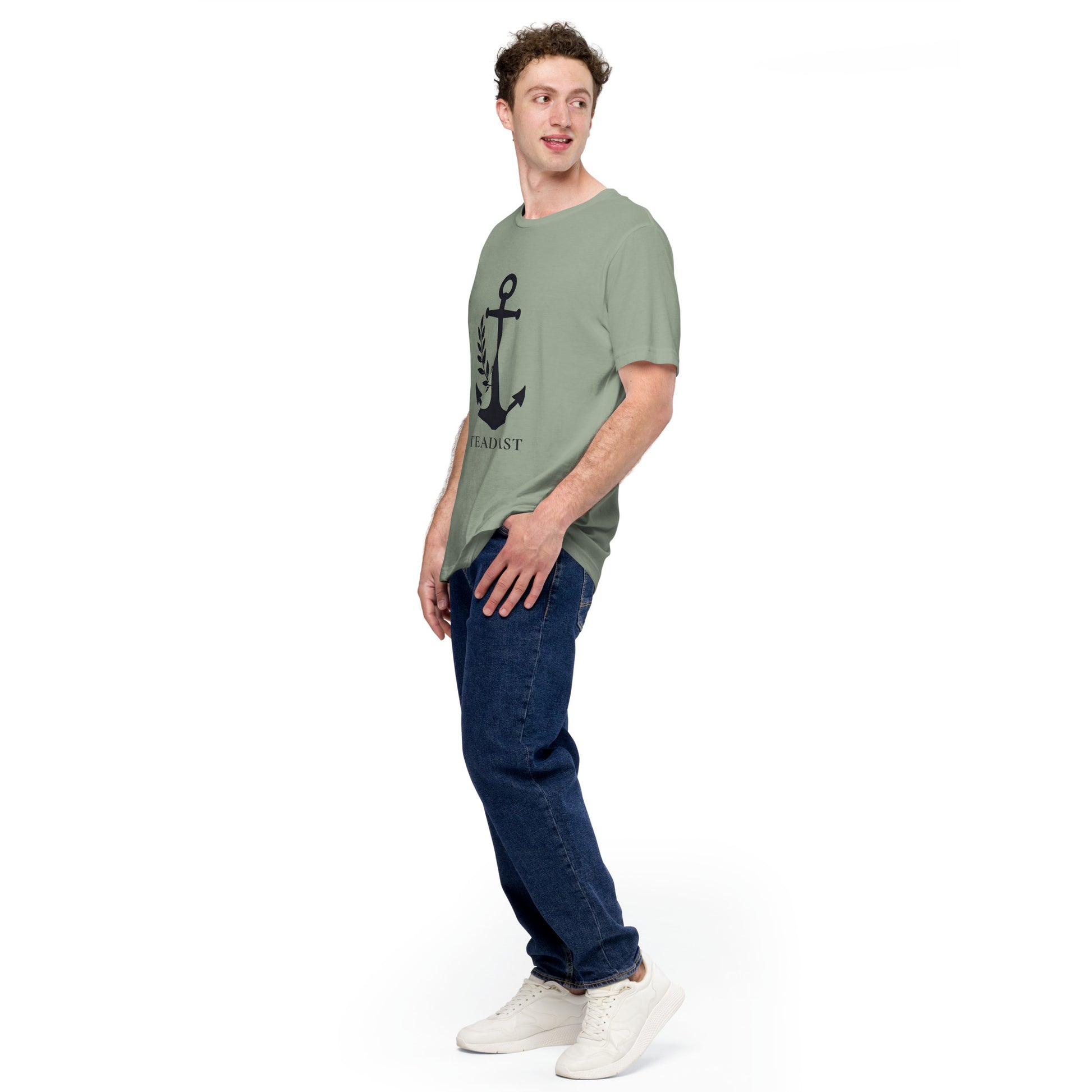 Male model in olive green Christian anchor shirt for men and women with black anchor print jeans and white sneakers