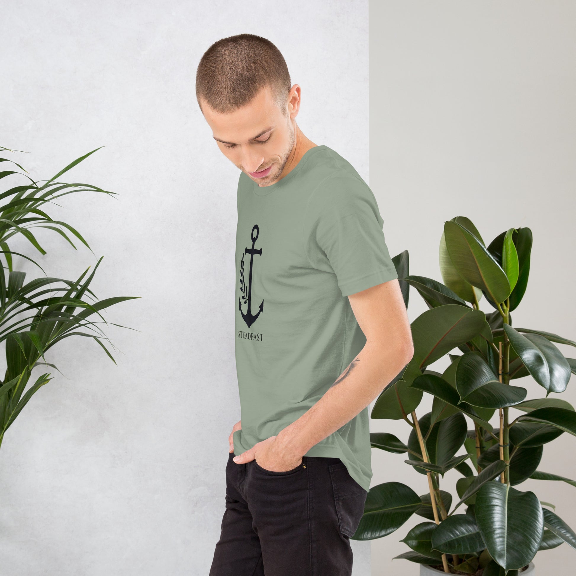 Spirit Wear male model wearing sage green Christian anchor shirt for men and women with black anchor graphic