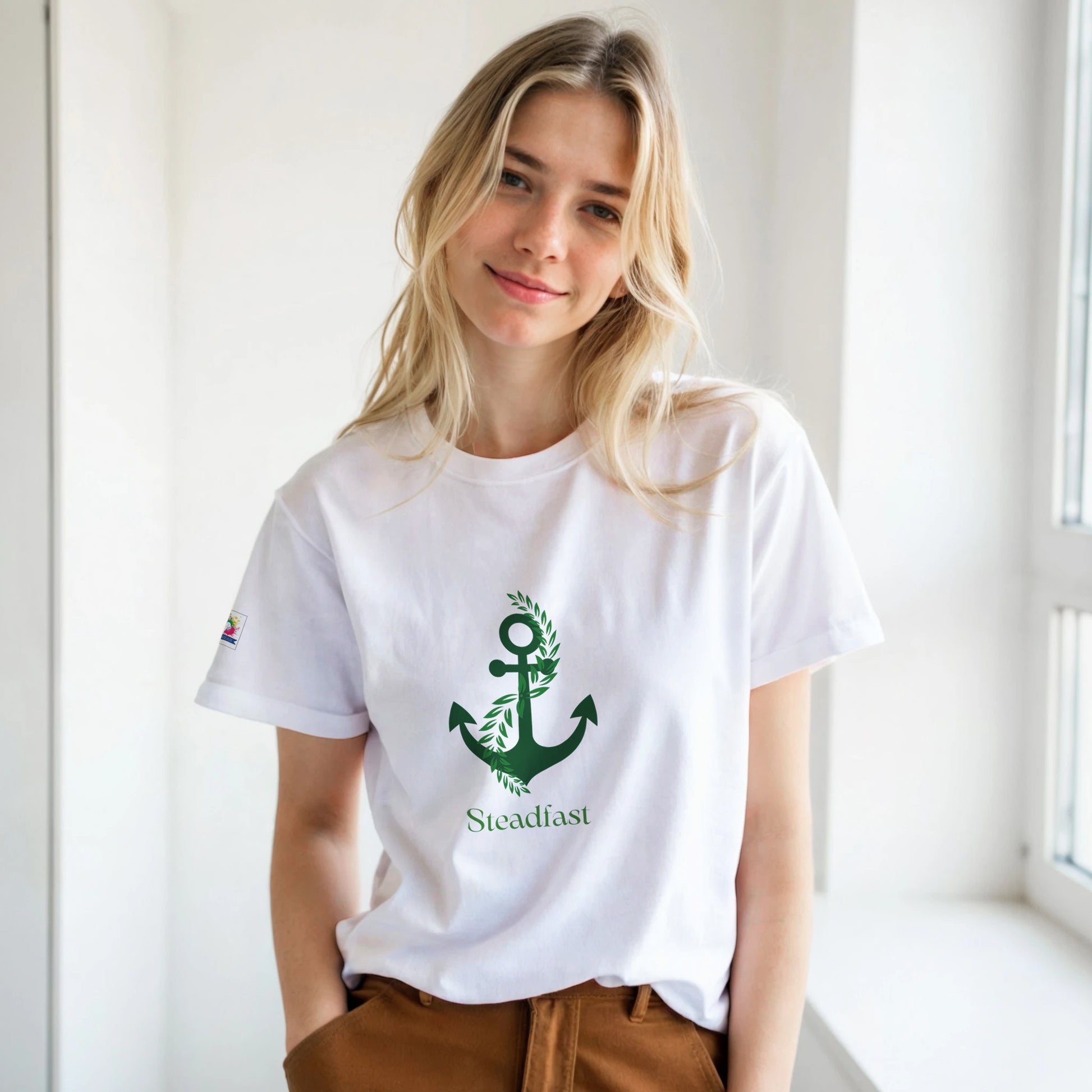 Spirit Wear white t shirt with green anchor Steadfast print worn by smiling woman Christian inspirational apparel
