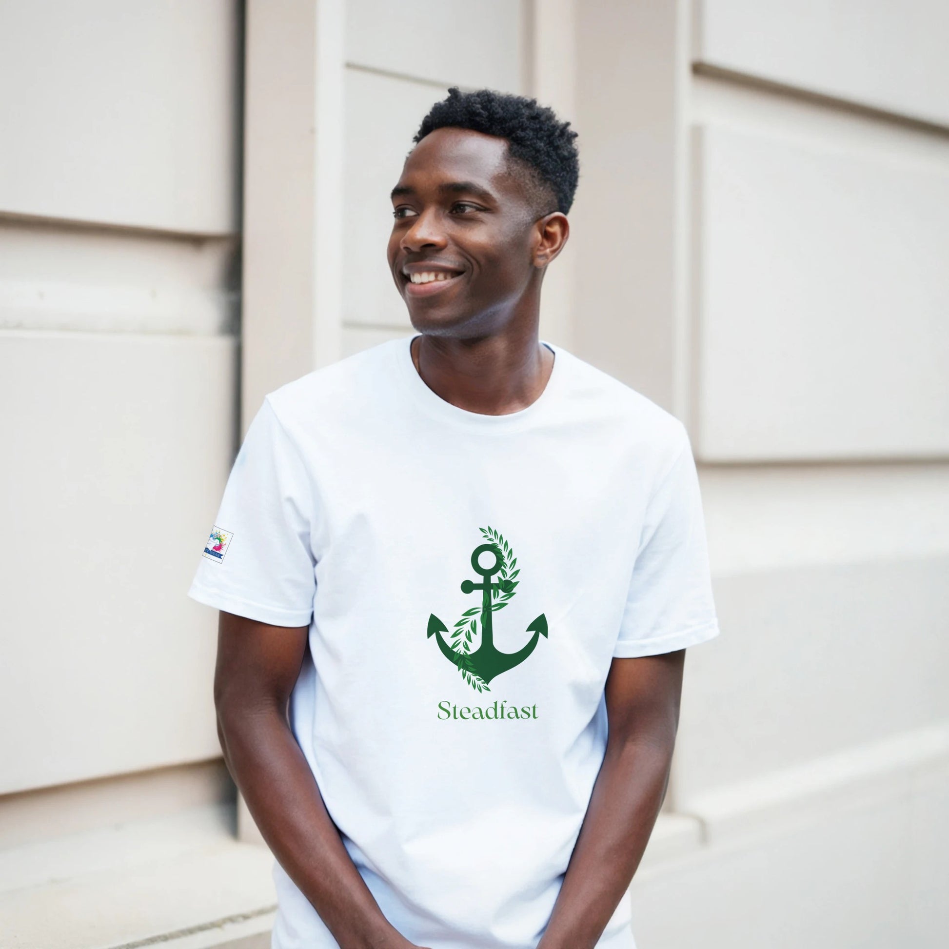 Spirit Wear white tee with green anchor Steadfast design worn by smiling model Christian inspirational apparel